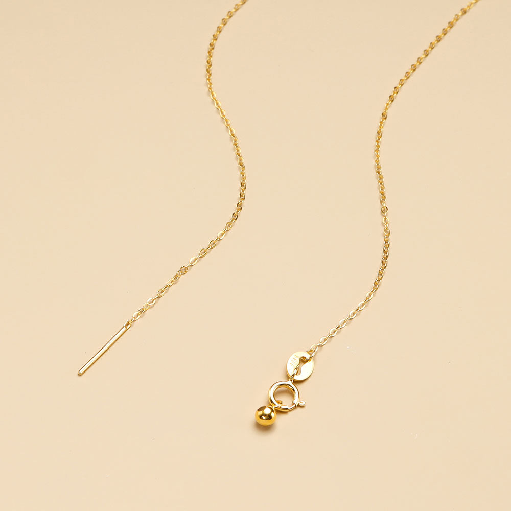 A opened simple gold chain.