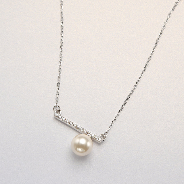 A single pearl necklace.