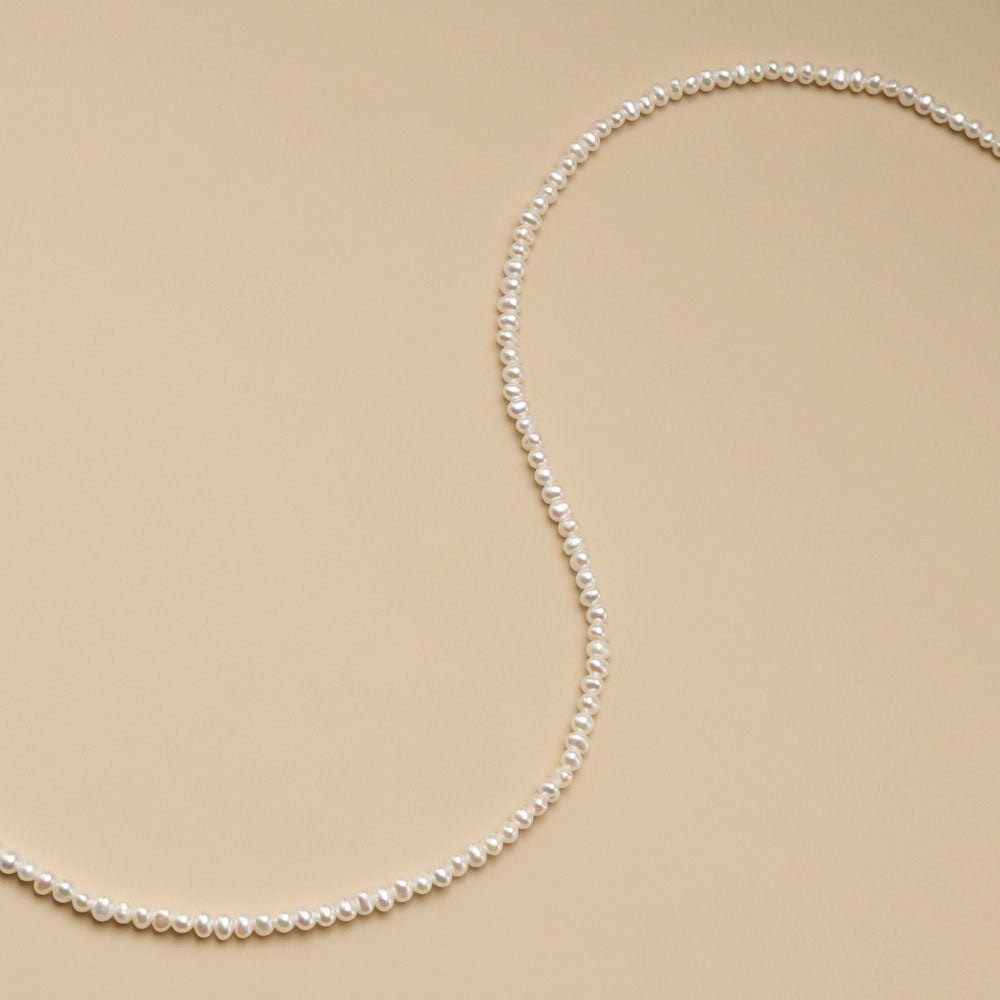 A string of small beads for jewelry making.