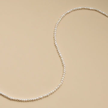 A string of small beads for jewelry making.