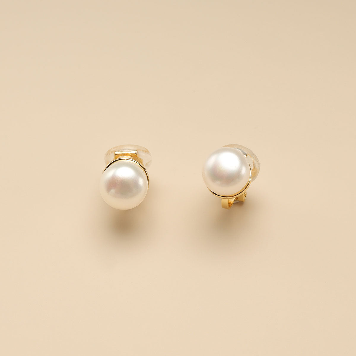 Small clip on pearl earrings.