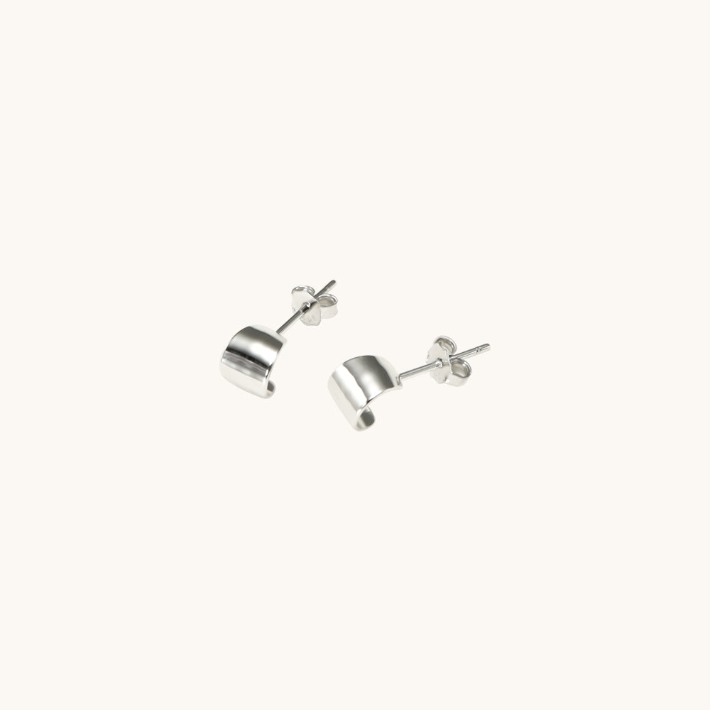 Small silver stud earrings.