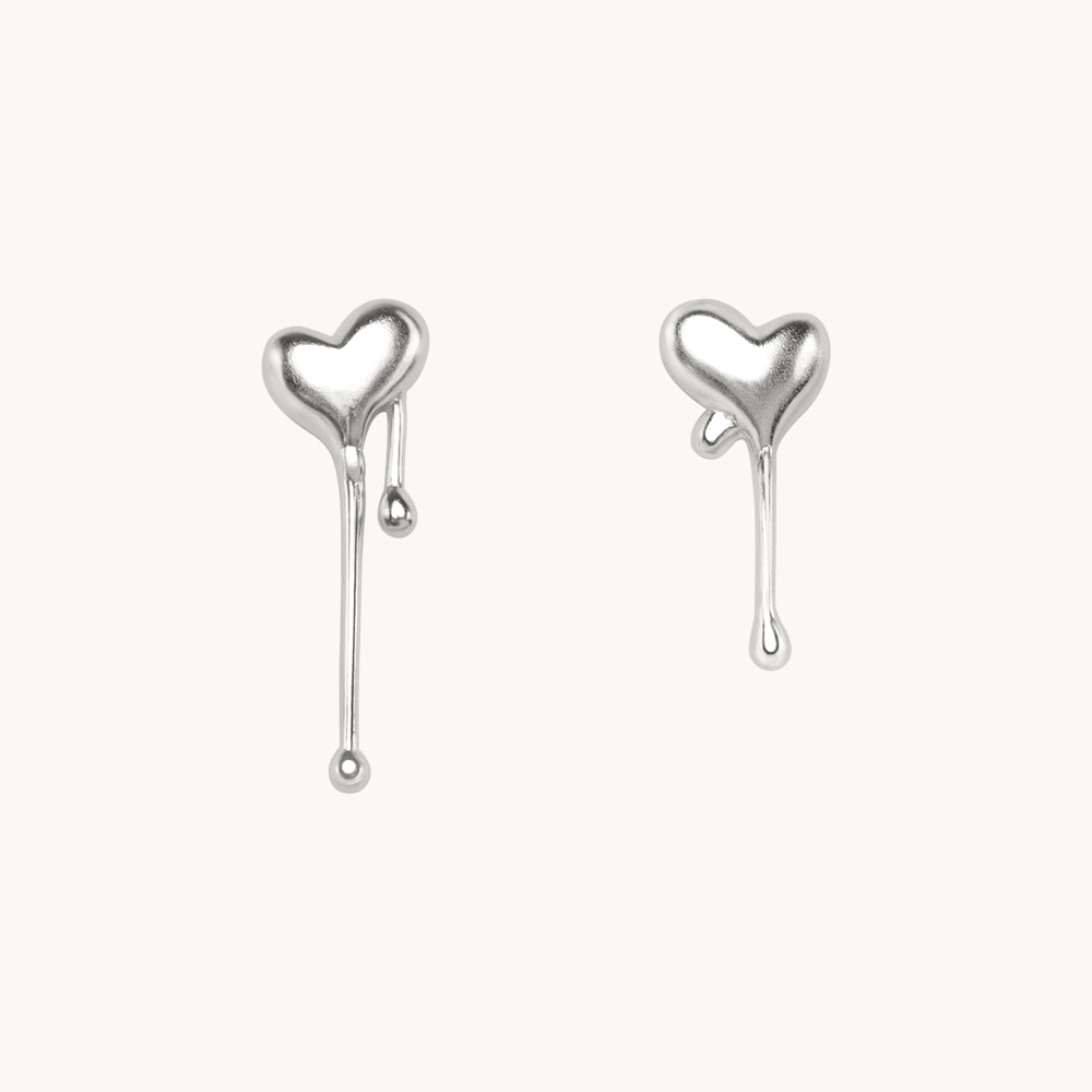 A pair of solid silver earrings.