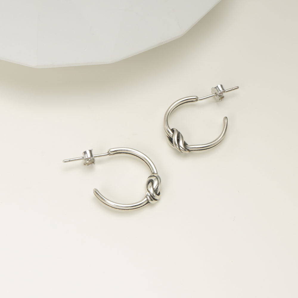 Sterling silver stud earrings.