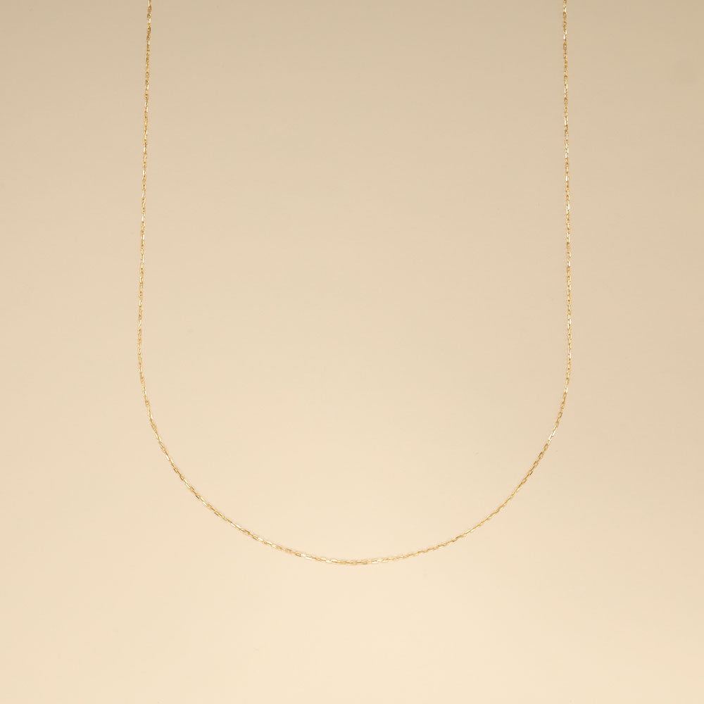 A 18k thin gold chain.