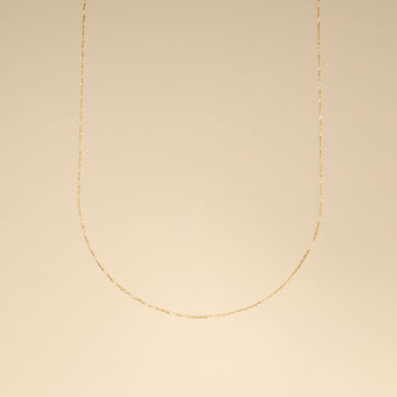 A 18k thin gold chain.