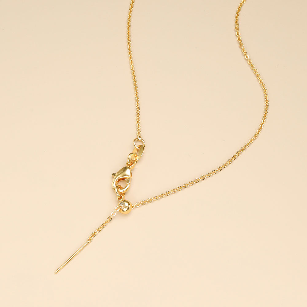 Thin gold chain with lobster claw slider clasp.