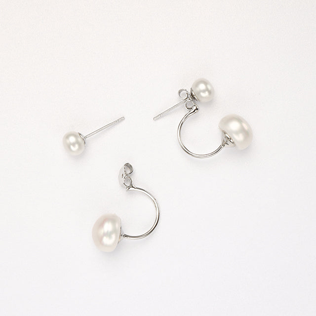 A pair of white freshwater pearl earrings.