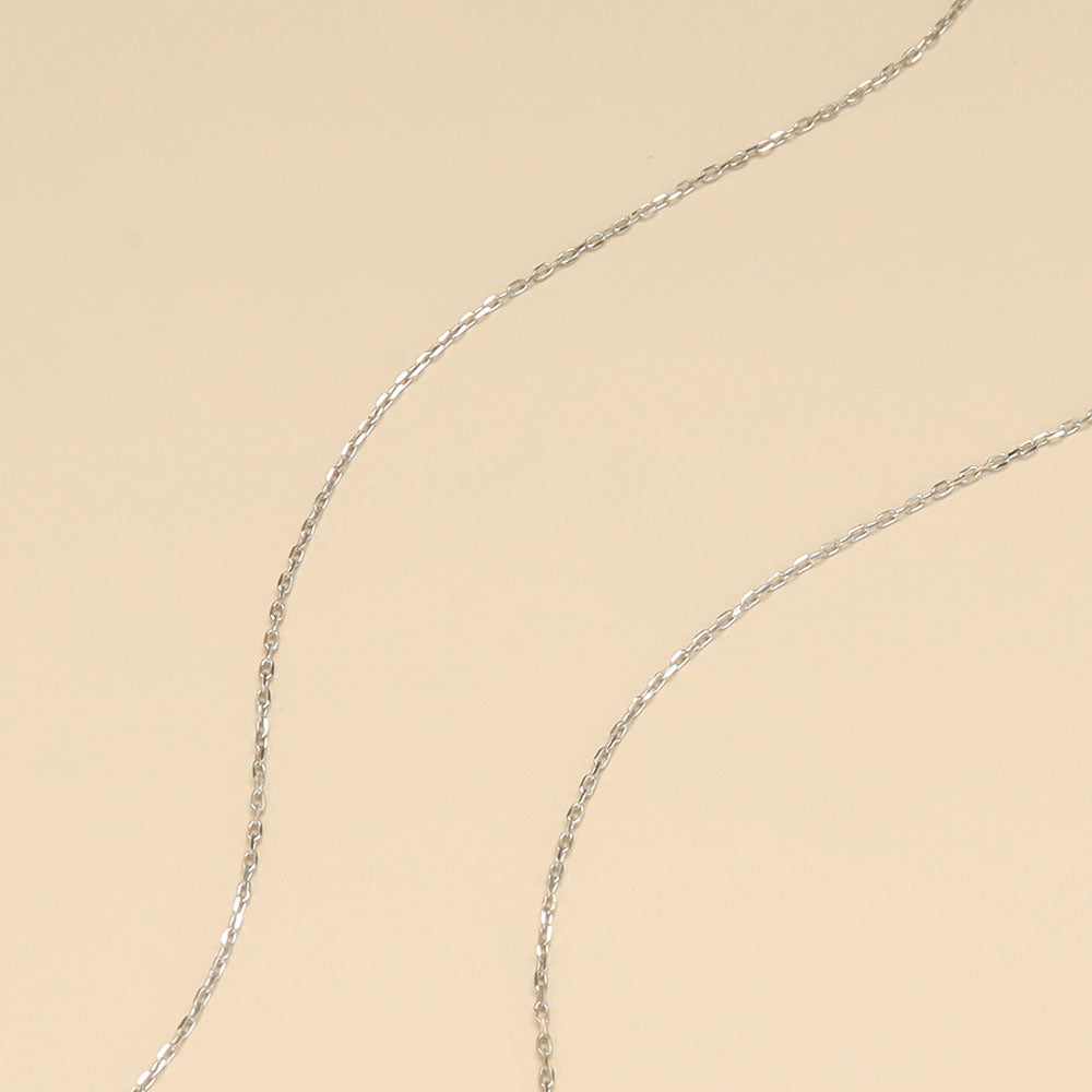 A close shot white gold necklace chain.