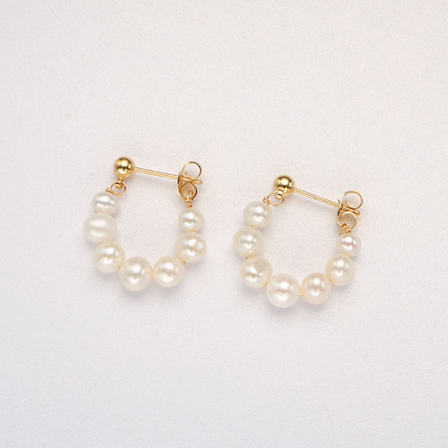 A pair of white pearl new look earrings.