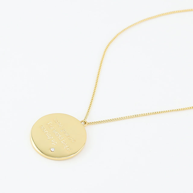 The back of wishing coin pendant.